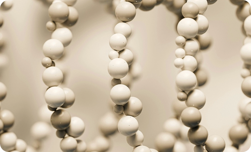 Chains of beige spheres in a pattern, resembling a molecular structure with a soft focus background.